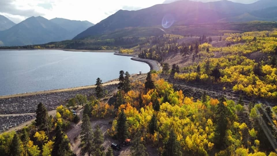 The crystal clear waters of Twin Lakes are surrounded by a sea of colorful autumn foliage in this aerial shot. Photo credit: Jake Jarvis