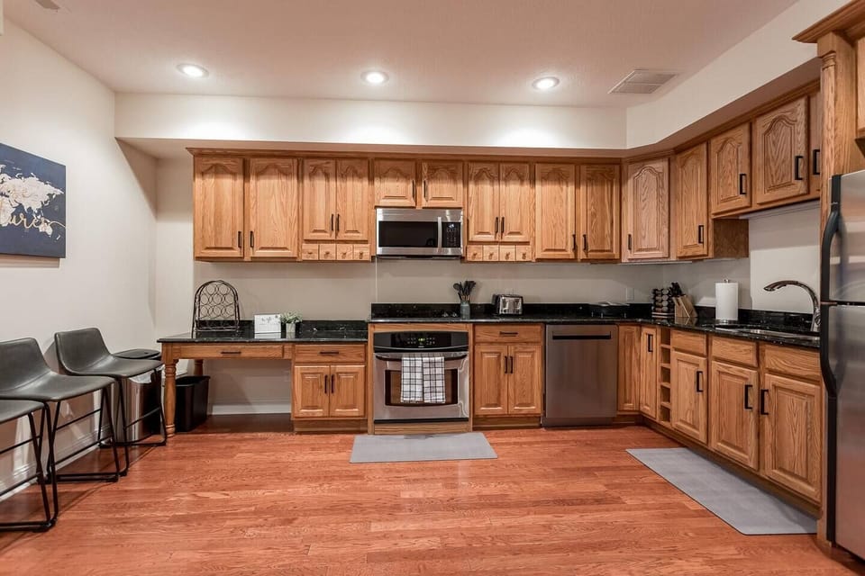 Abundance of cabinetry with cooktop, oven, microwave, dishwasher and refrigerator/freezer