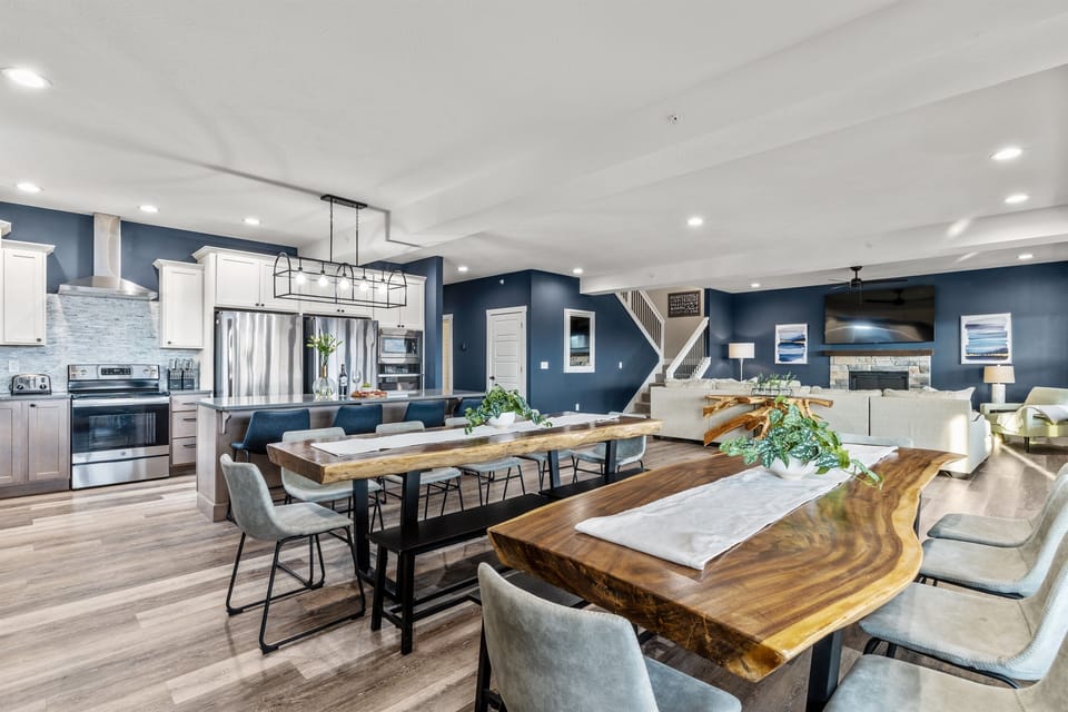 Huge open concept Great Room (kitchen/living/dining.) Hardwood floors, vaulted ceilings, large windows, tons of natural light. This enormous, fully-equipped kitchen has ample storage space, and everything you could ever want for the vacation of a lifetime.