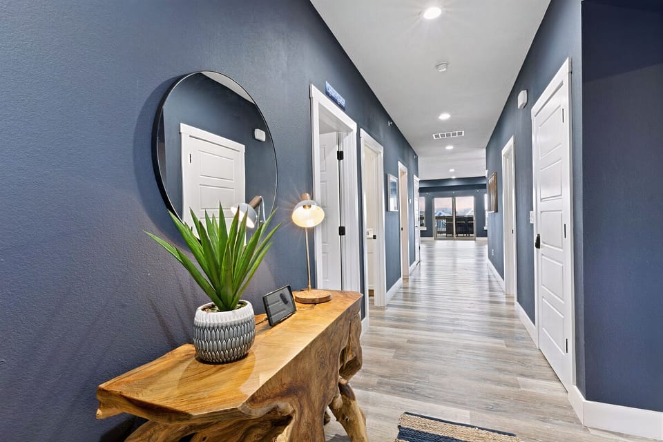 Anchor yourself at this luxury lodge and relax after a day outdoors. Beautiful main entry hallway. Driftwood welcome table. Nautical/Marine/Hamptons-style decor. Scenic tranquility, pastel sun