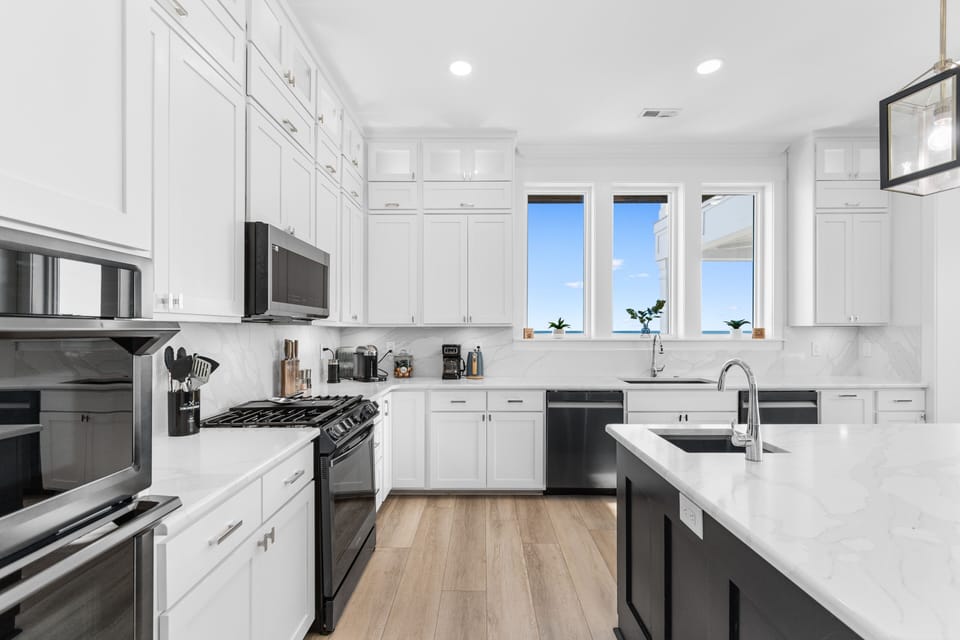 Cook memorable meals in your fully-equipped modern kitchen with granite counters, premium appliances, and bright windows.