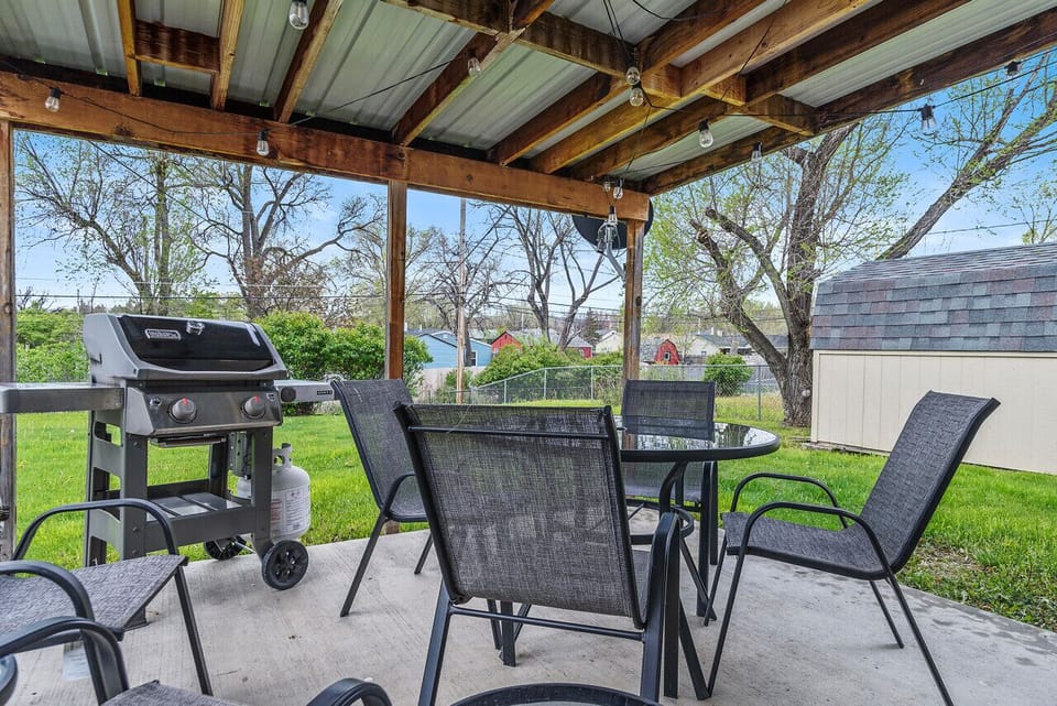Enjoy al fresco dining and leisurely moments on the covered patio, offering a charming outdoor retreat for meals and relaxation.