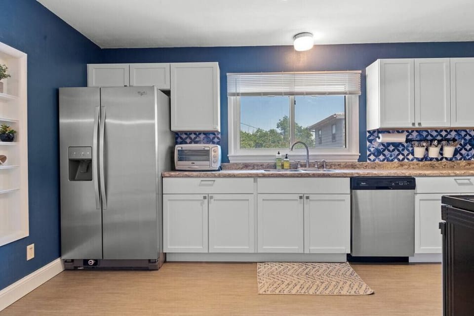Kitchen Area, refrigerator, stove, oven, coffee maker, kitchen utensils