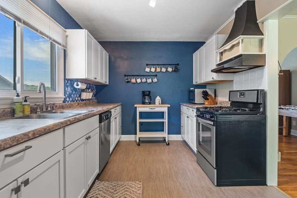 Kitchen Area, refrigerator, stove, oven, coffee maker, kitchen utensils