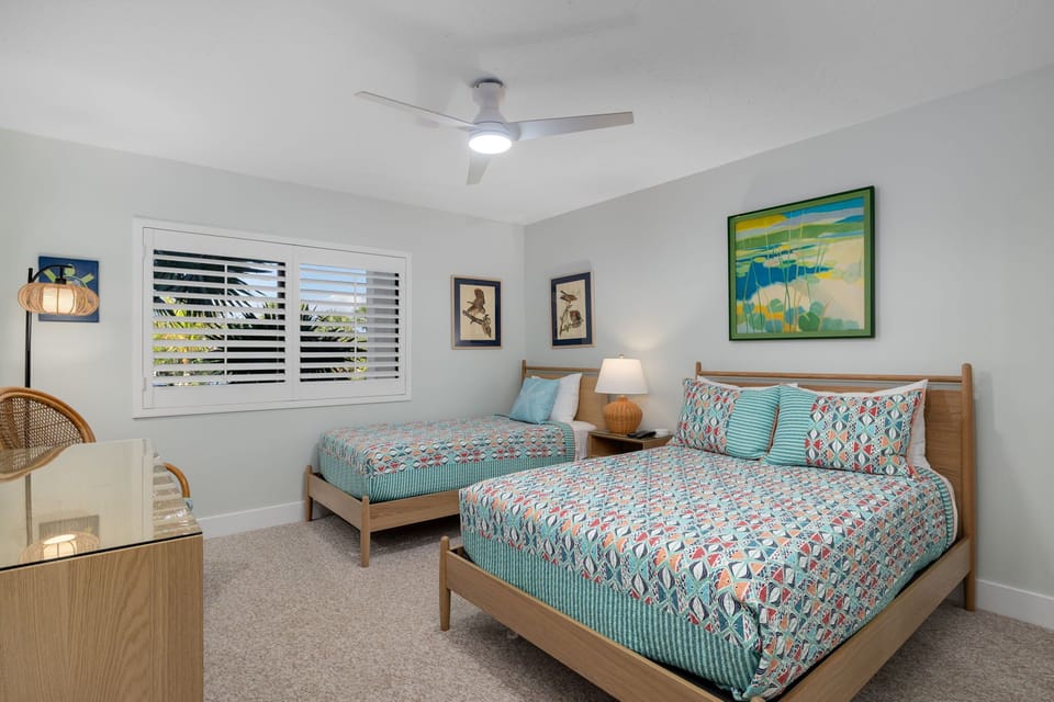 Guest bedroom with double bed and twin bed