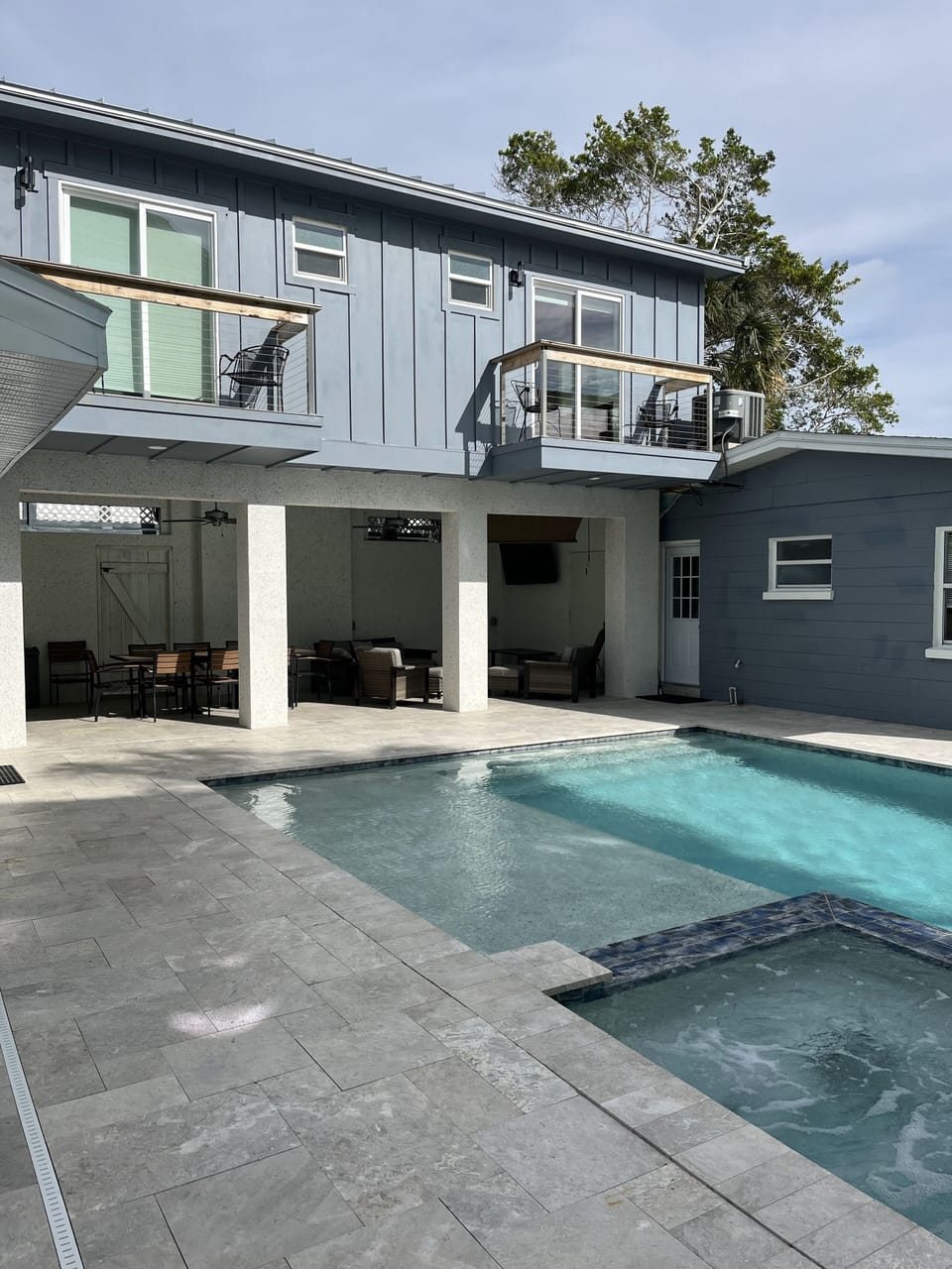 Covered patio, w/ 2 bed, two bath above,  Pool & Hot Tub