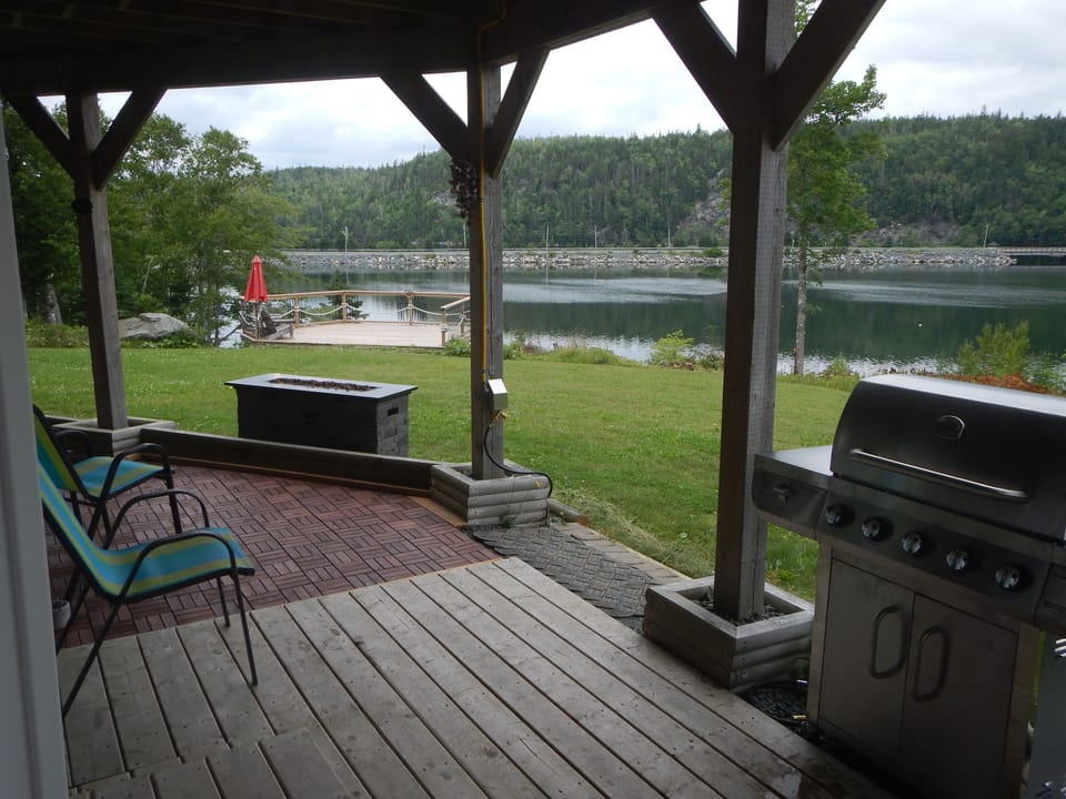 This is your private patio with bbq. large dining table and fireside furniture.