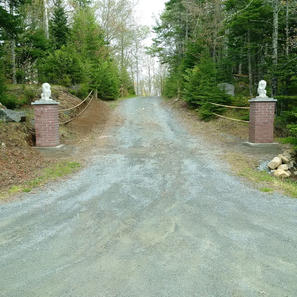 Driveway pillars with lions as your entry.