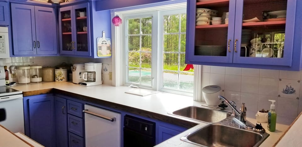 Kitchen with views over the deck, pool, and ocean