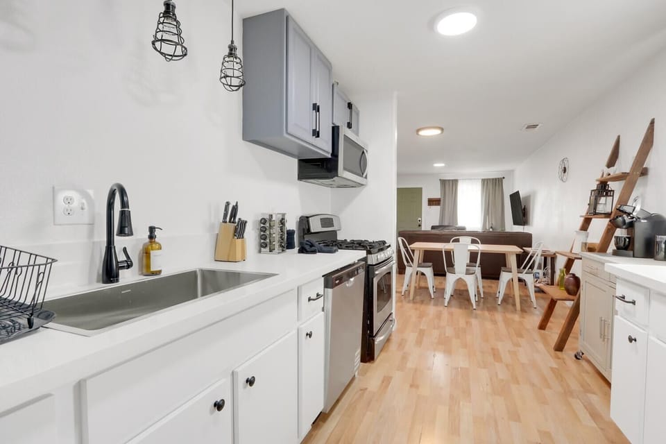 All the kitchen supplies are nicely organized in our newly refurburished cabinets. Plates, bowls, utensils, glassware, wine, appliance, kitchen cleaning supplies, knives and cutting board. 