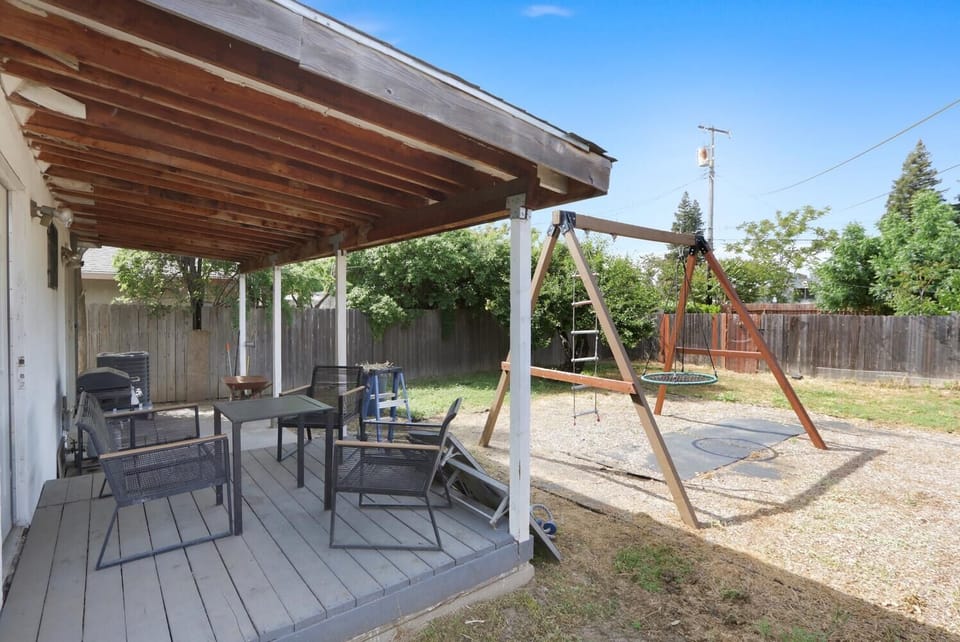 Custom built farmhouse 9ft high swingset & playset in the back yard. Comes with two swings, a play ladder, play rope set and spiderweb tree swing. Use upon your own discretion and understand a