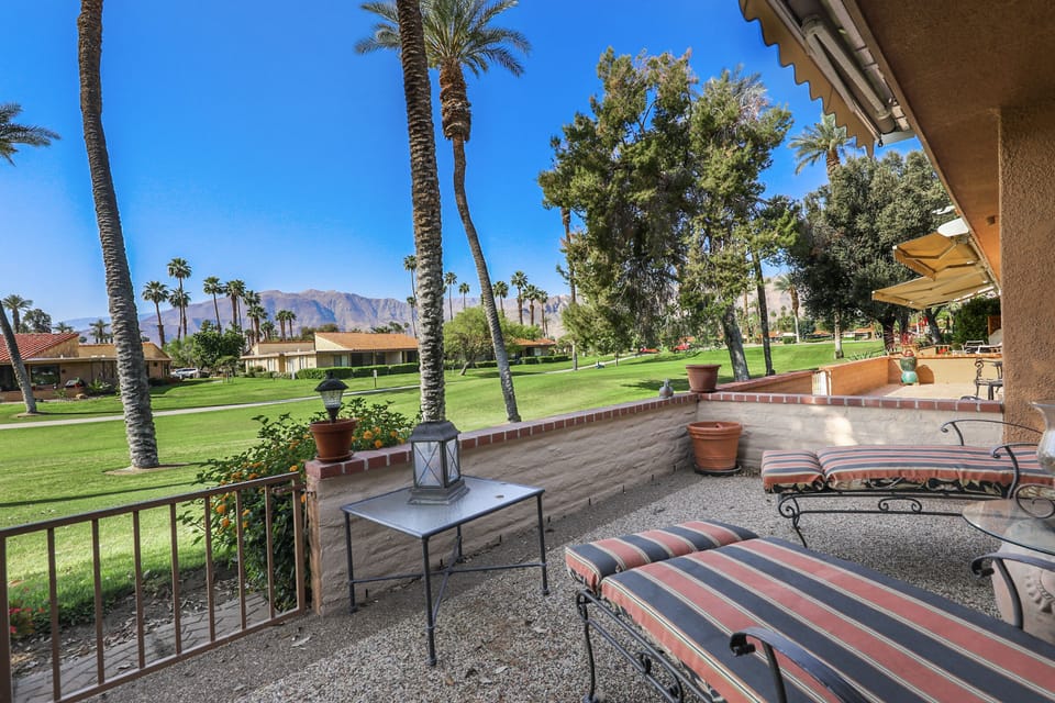 Enjoy the south facing rear patio to mountain views from the two lounge chairs.