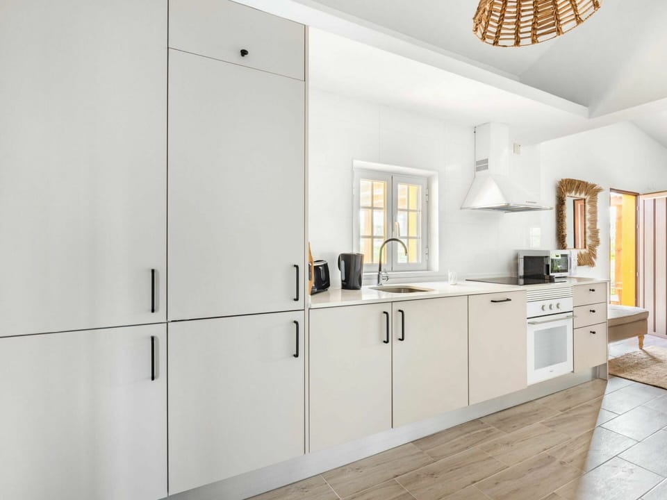 Cabinetry, Property, Countertop, Building, Product, Lighting, Interior Design, Ceiling Fan, Architecture, Wood