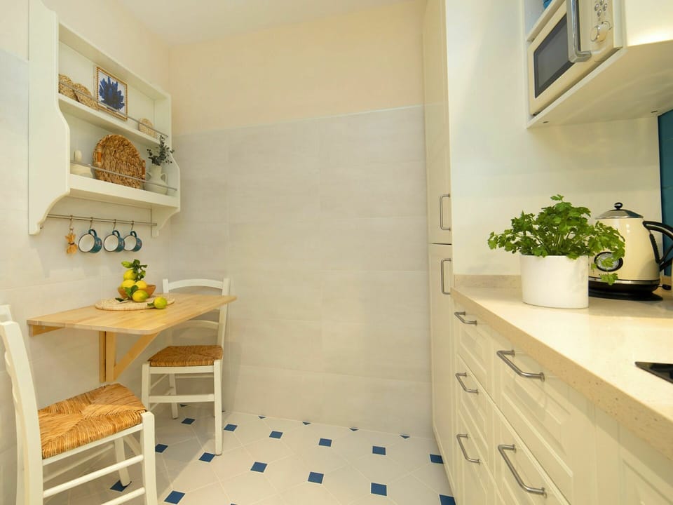 Plant, Furniture, Cabinetry, Table, Picture Frame, Houseplant, Wood, Building, Desk, Shelving