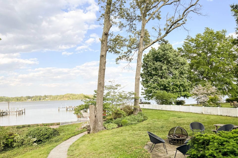 The path leads past the firepit and out to the private pier.
