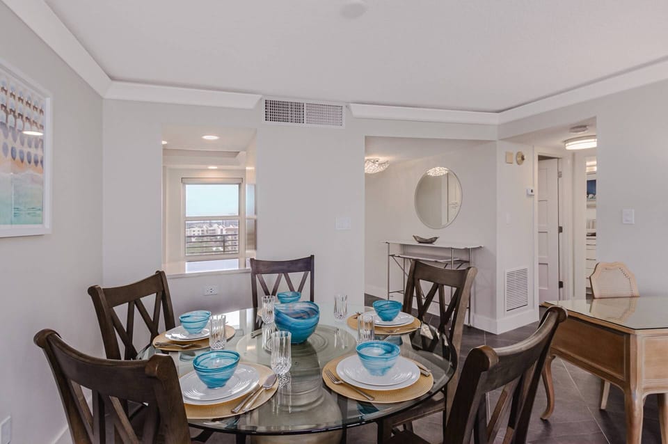 Dining table for 6 total with a convenient pass thru to the modern kitchen