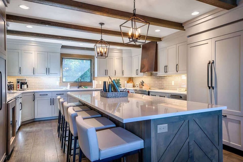 We have a spacious family kitchen that is adjoined to the dining area with comfortable bar stools. It's a great place to gather and enjoy a meal or a quick snack.