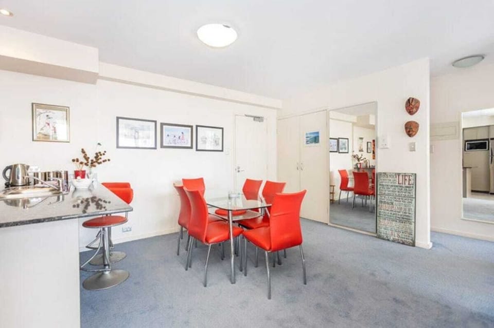 Enjoy meals in the spacious dining area, featuring a dining table that comfortably seats six, conveniently located adjacent to the kitchen area.