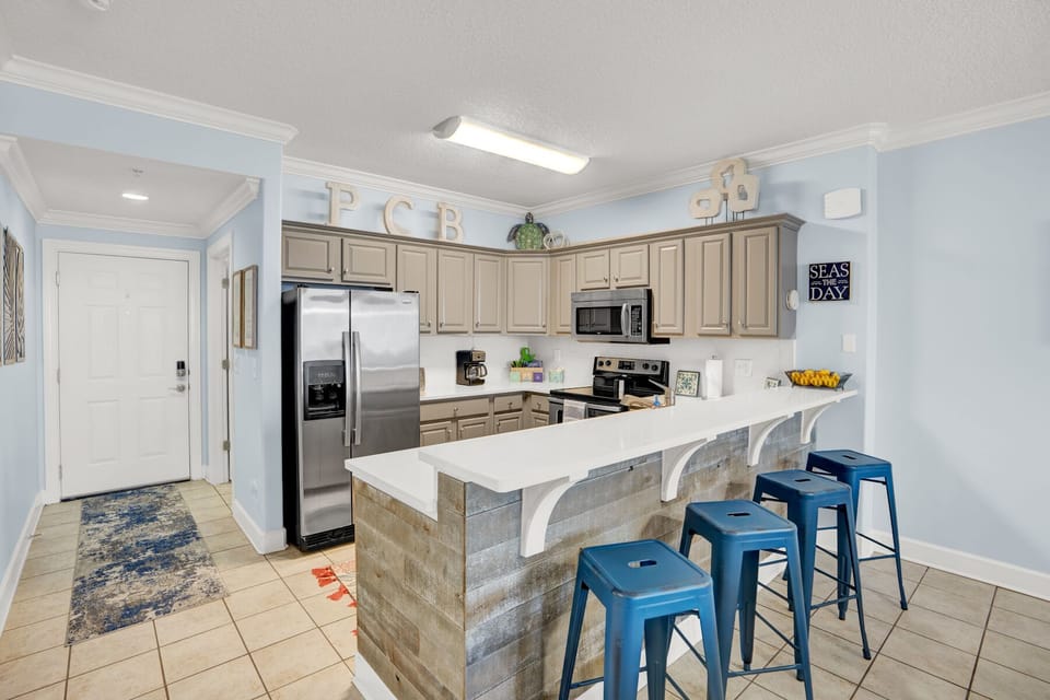 Whip up delicious meals in your spacious, fully-equipped kitchen featuring modern appliances, granite counters, and a breakfast bar where you can sip coffee.