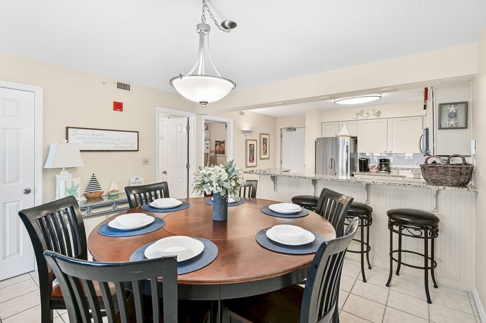 Gather your group around this elegant dining table, perfectly set for memorable meals together in your vacation home.
