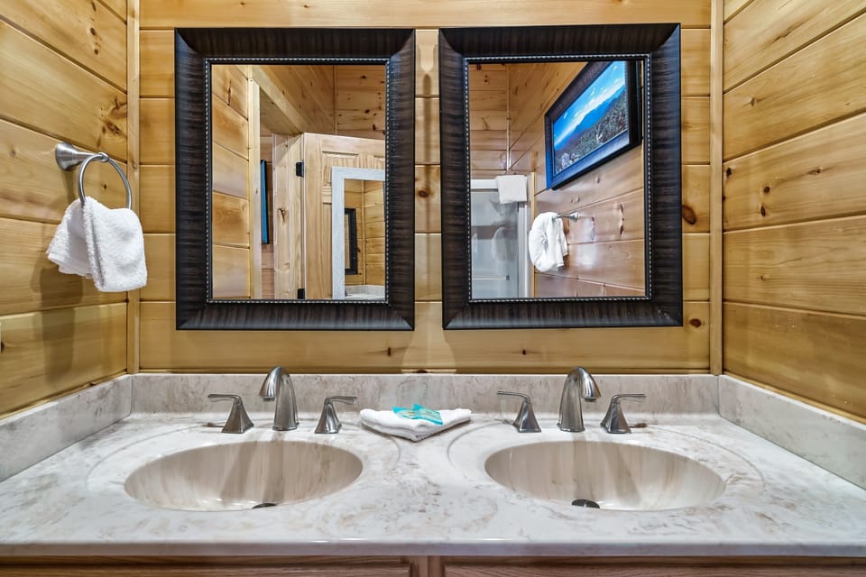The ensuite master bath has a full length mirror, double bowl sink and tub/shower combination.