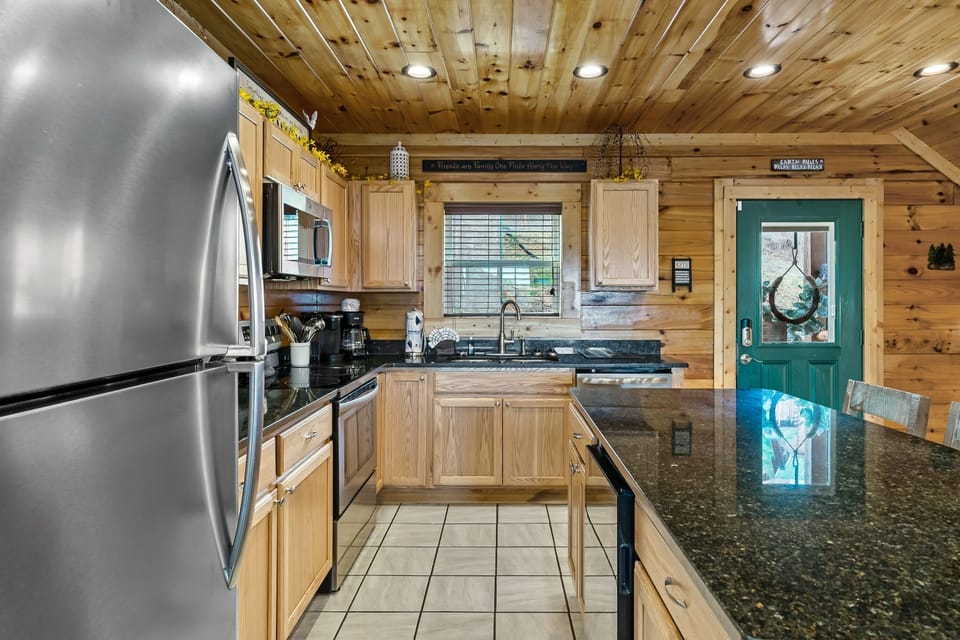 The kitchen is fully equipped and even features a wine fridge!