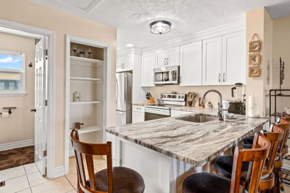 This stylish kitchen features modern appliances and all the essentials for effortless meal prep.