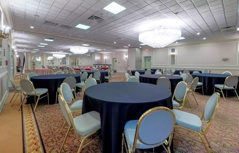 Host unforgettable gatherings beneath sparkling chandeliers in elegant space.