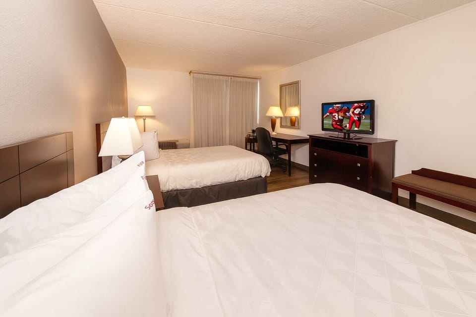 Settle into crisp linens and relax with in-room entertainment.