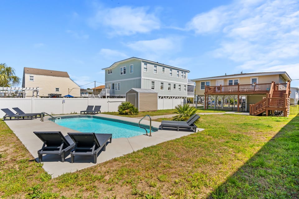 Relax in the lounge chairs while the kids splash in the pool.
