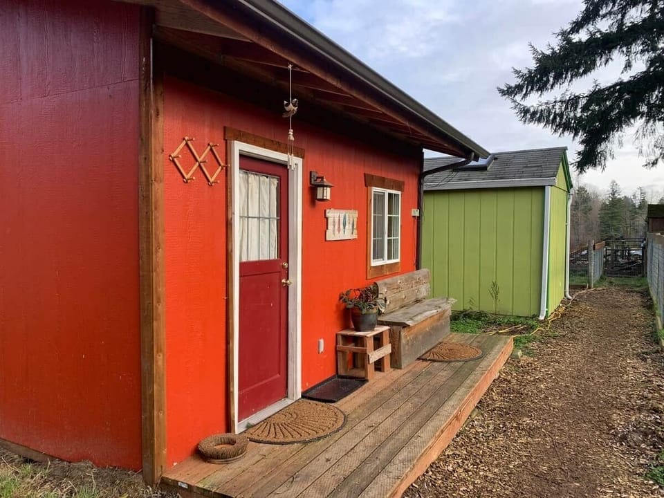 Relax and enjoy the goats on the front porch.