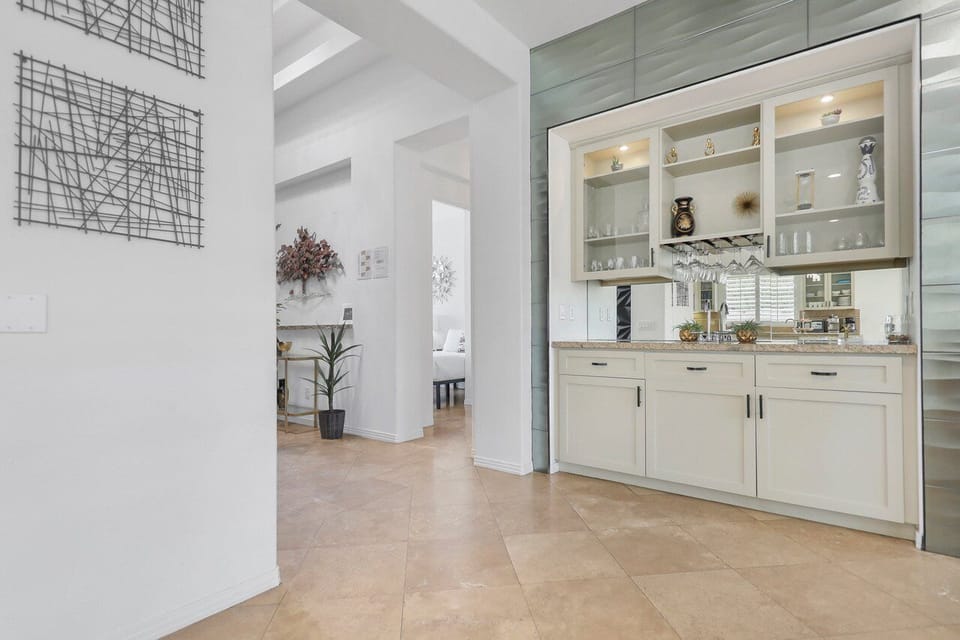 Swing by and grab a refreshing drink from the bar near the entrance! It's the perfect way to kick off your time here.