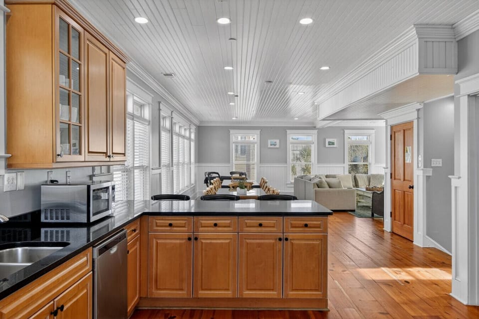 Standing in kitchen looking over dining tables
