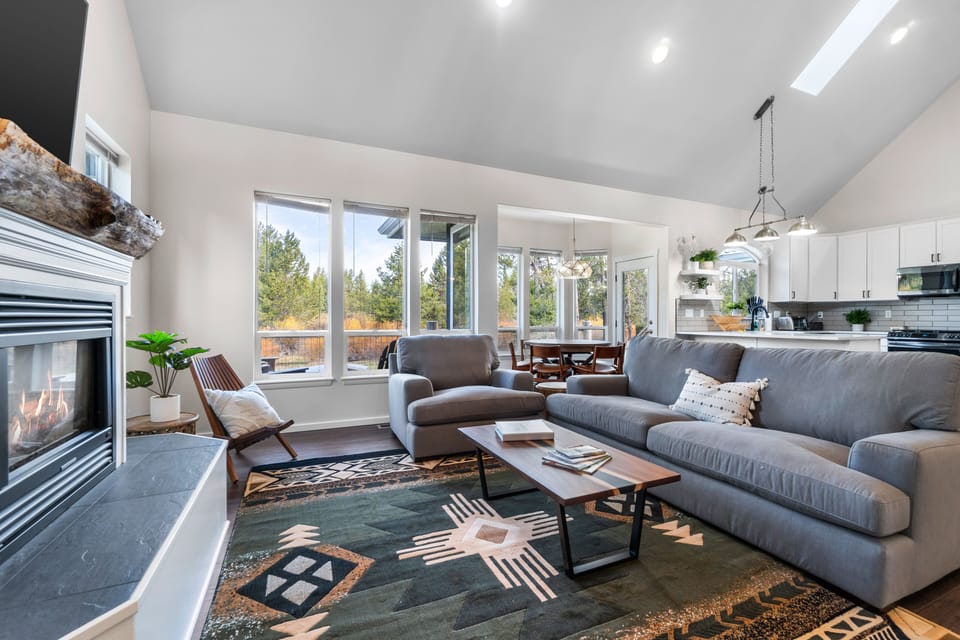 Living room view with big windows facing the river