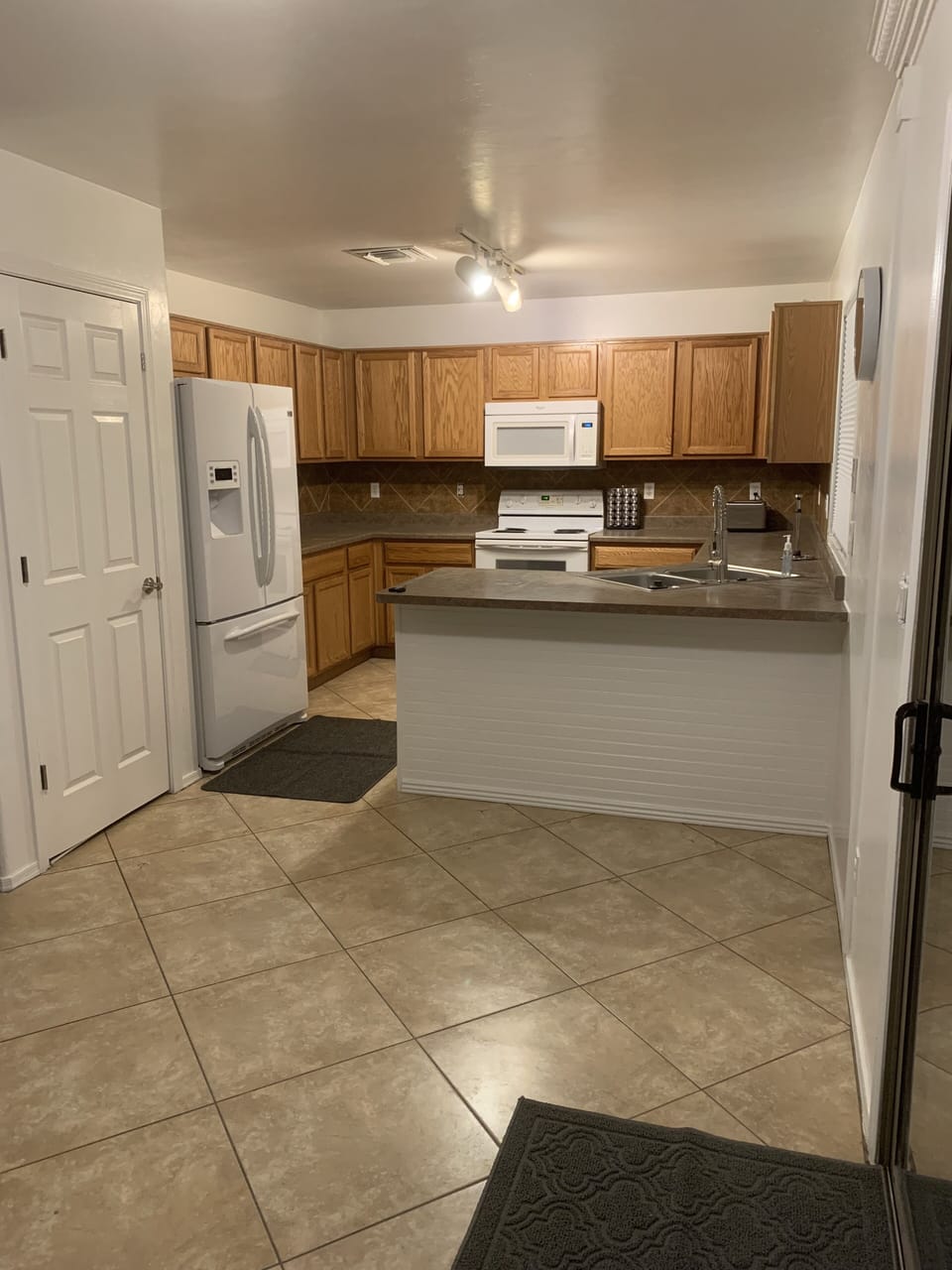 Kitchen with refrigerator, oven/stove, microwave, dishwasher, Kuerig coffeemaker