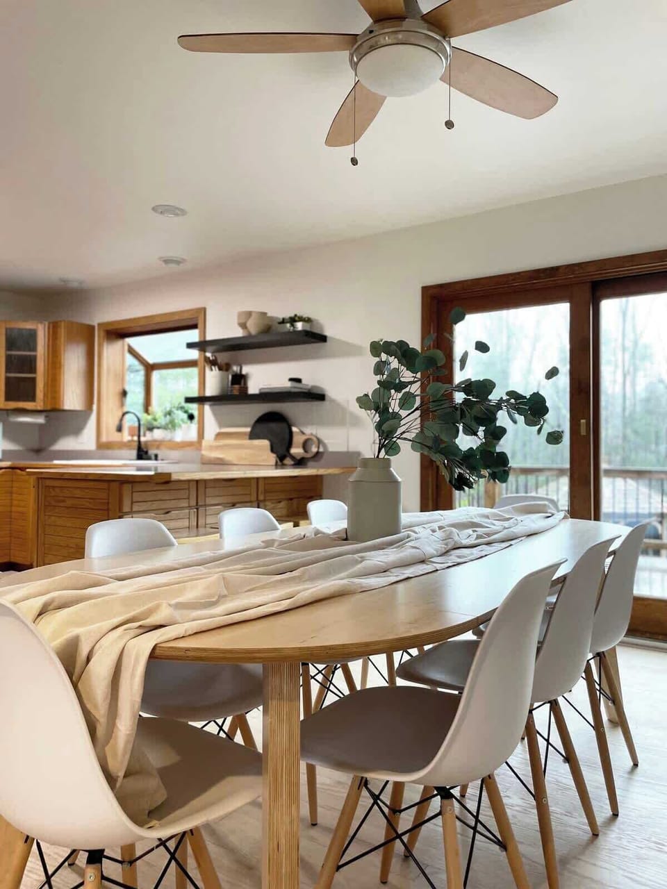 The open plan kitchen and dining room offers access to the wrap-around porch and is a central hub in the home.  The table seats 8 comfortably, with a further 3 seats at the bar.  A highchair is available on request.   