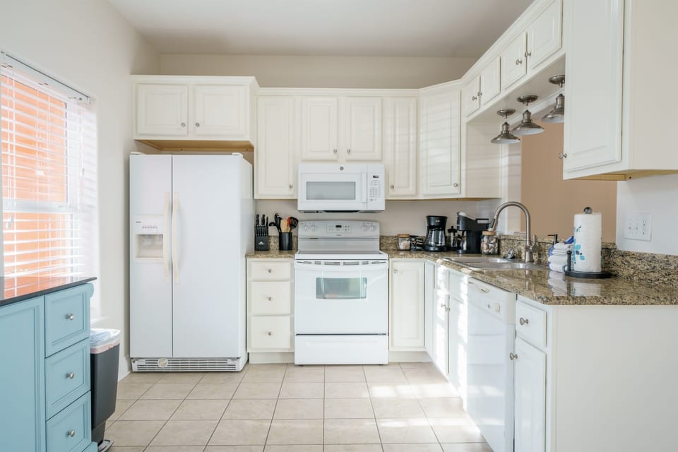 This kitchen is equipped with the essentials for all of your vacation meals. 