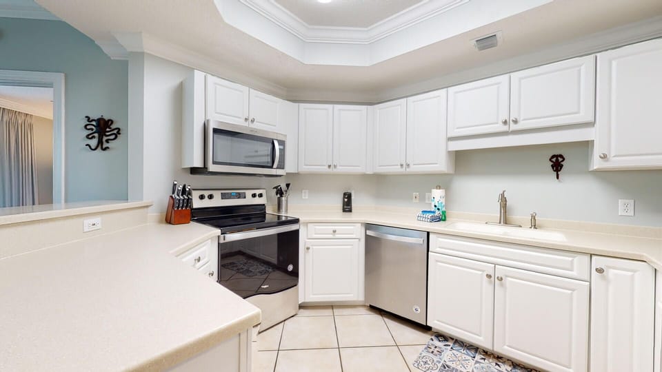 Discover culinary inspiration in our well-equipped kitchen, featuring all the tools and amenities necessary to craft your favorite meals with ease.