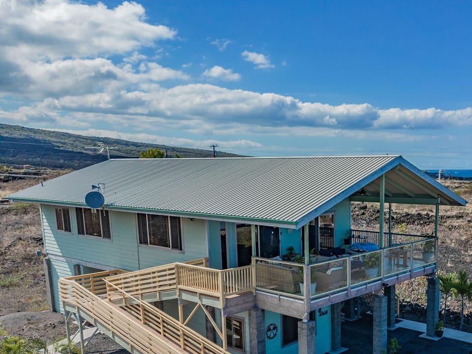 The slopes of Mauna Loa as the backdrop & 180 degree the Pacific Ocean view.