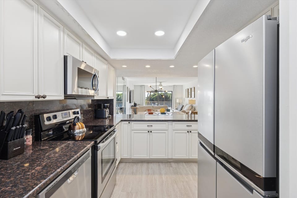 Bright and modern kitchen with sleek finishes and ample space.
