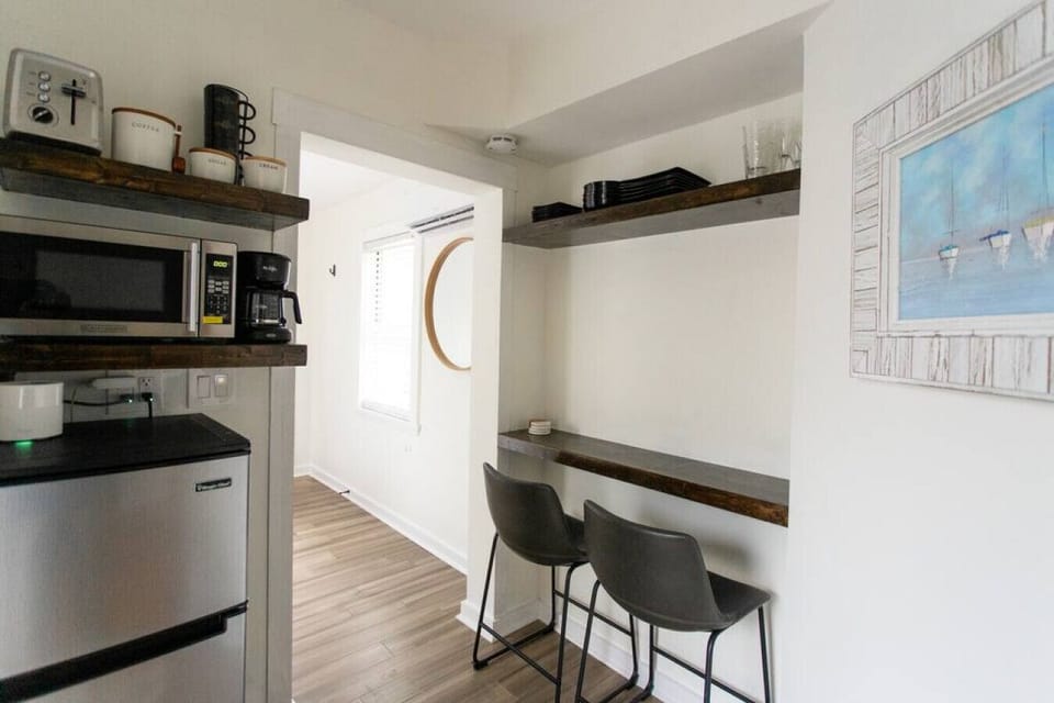 The small counter top can be used for eating or remote working with a laptop