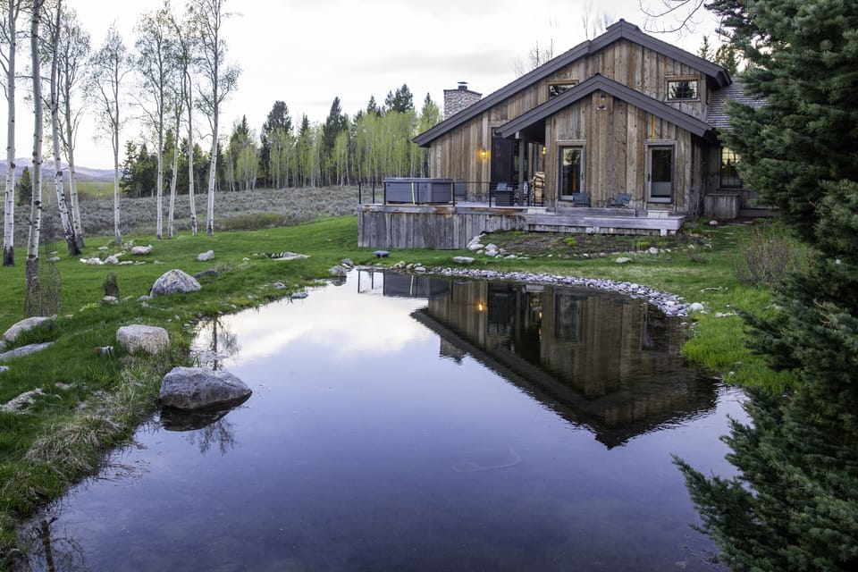 Tranquil pond on property