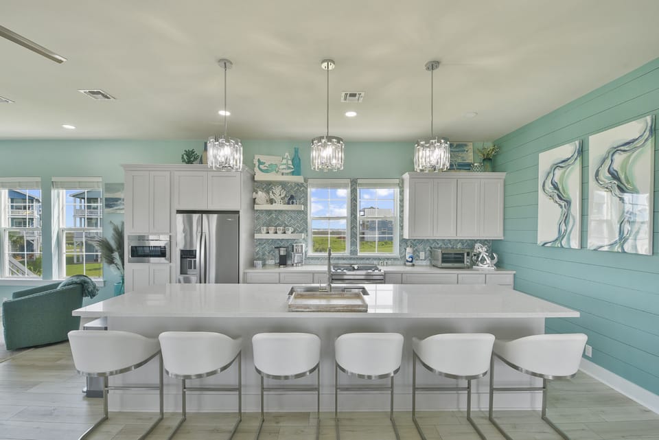 Kitchen island provides multiple seating.