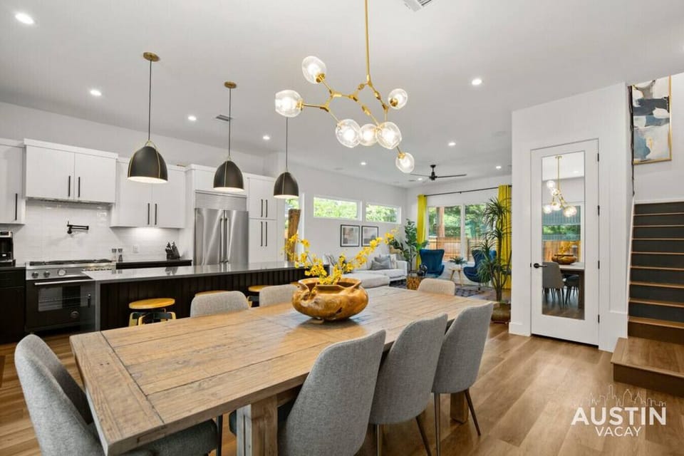 Large kitchen and dining room with slider door leading to the backyard