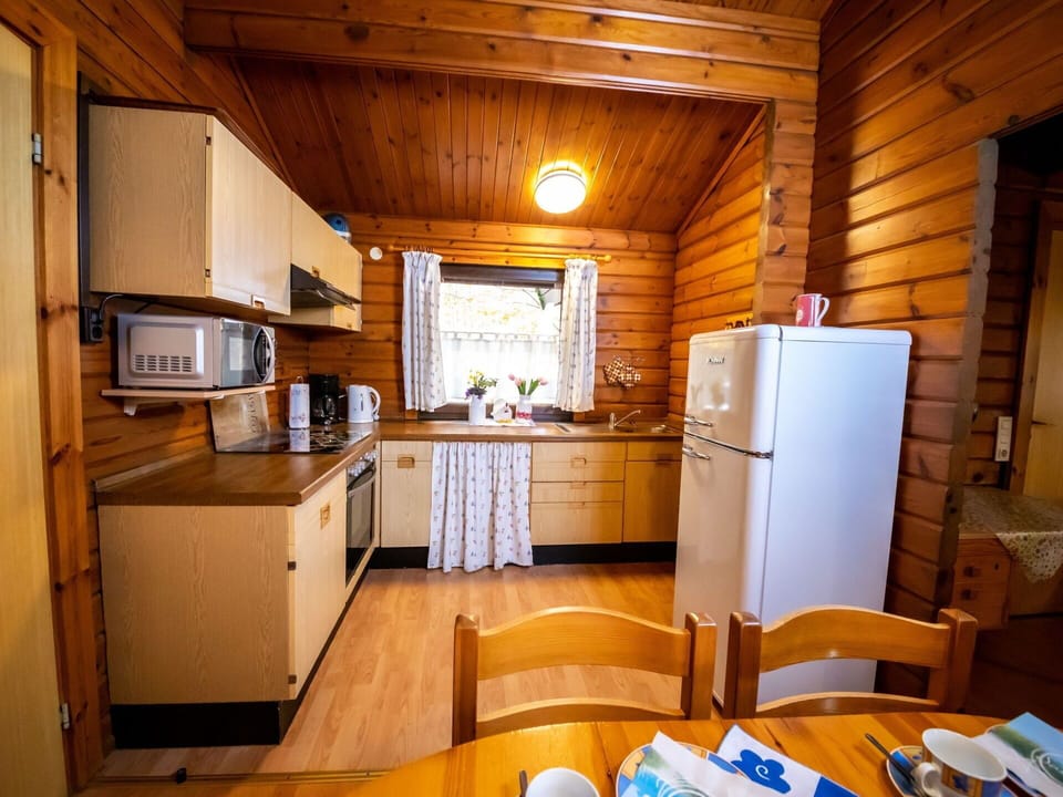 Cabinetry, Property, Furniture, Countertop, Table, Kitchen Sink, Kitchen Appliance, Refrigerator, Kitchen, Wood