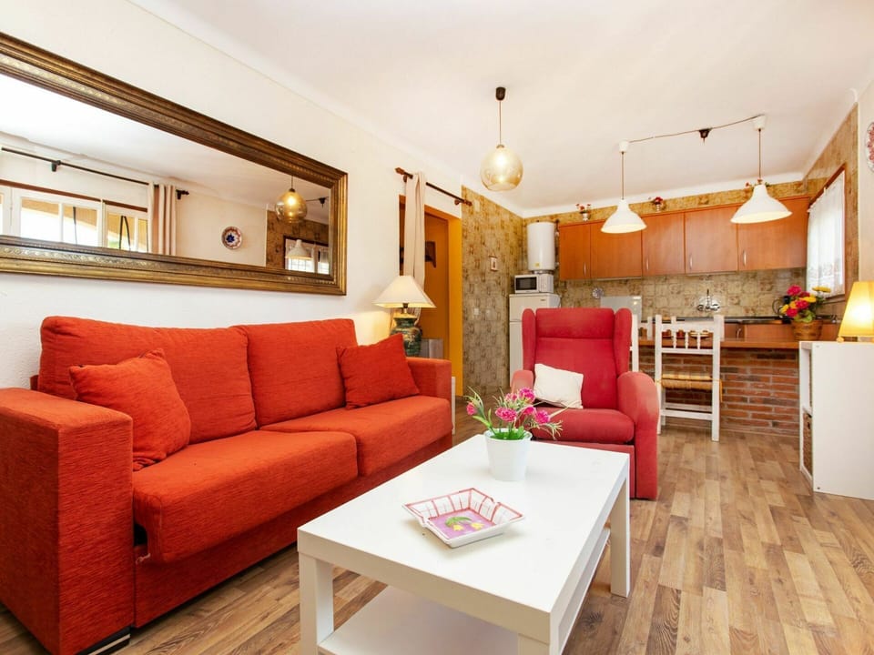 Couch, Furniture, Property, Table, Picture Frame, Orange, Comfort, Building, Interior Design, Lighting