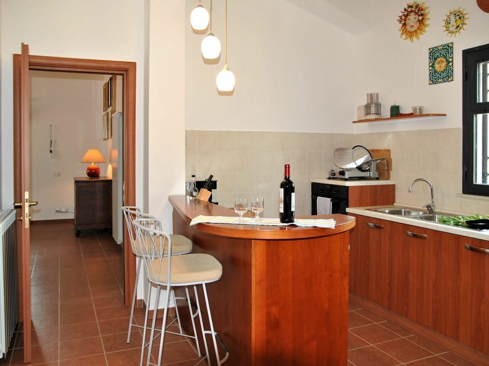 Table, Furniture, Property, Cabinetry, Countertop, Chair, Wood, Picture Frame, Drawer, Lighting
