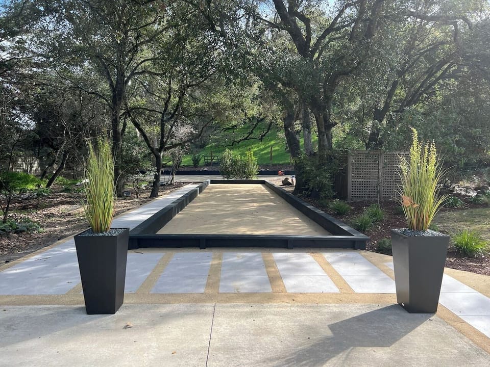 This oasis has over an acre of flat land for playing! Bocce court, pool table, outdoor dining, bar and grill pavilion, and a gas-heated pool and spa.