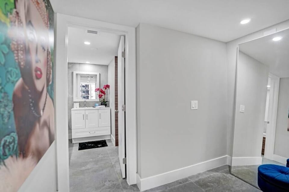 Full length mirror outside private master bathroom, next to huge walk in closet