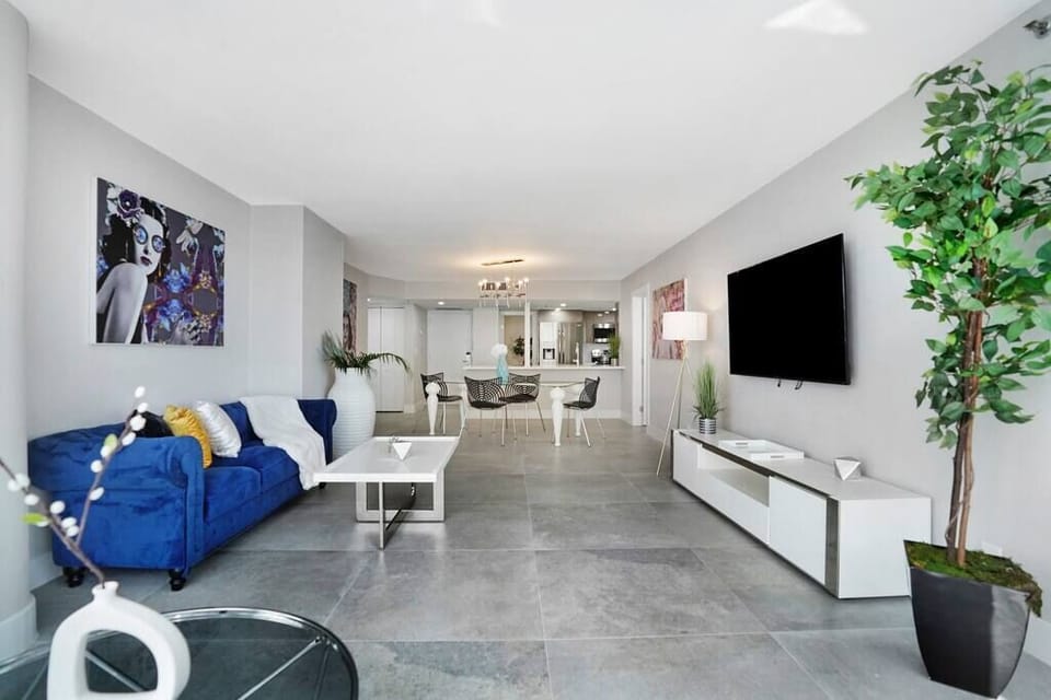 Living room. Roku streaming tv, dining area, balcony access